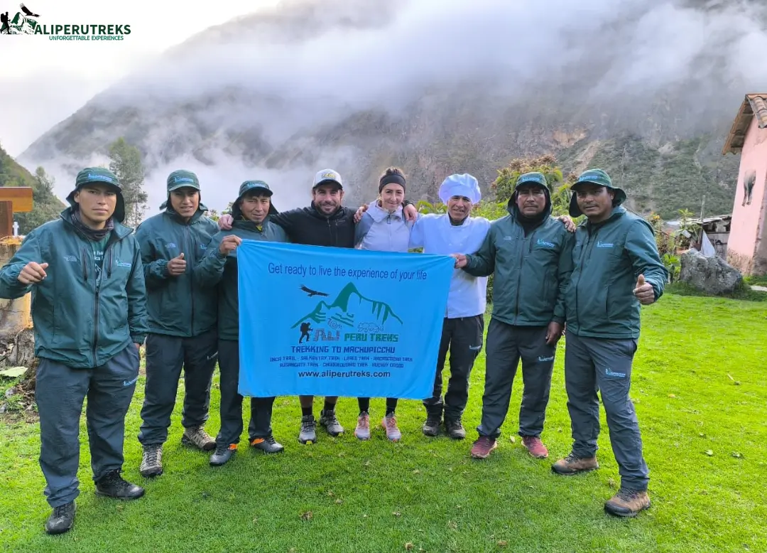 Happy Trekking Group Posing with Banner