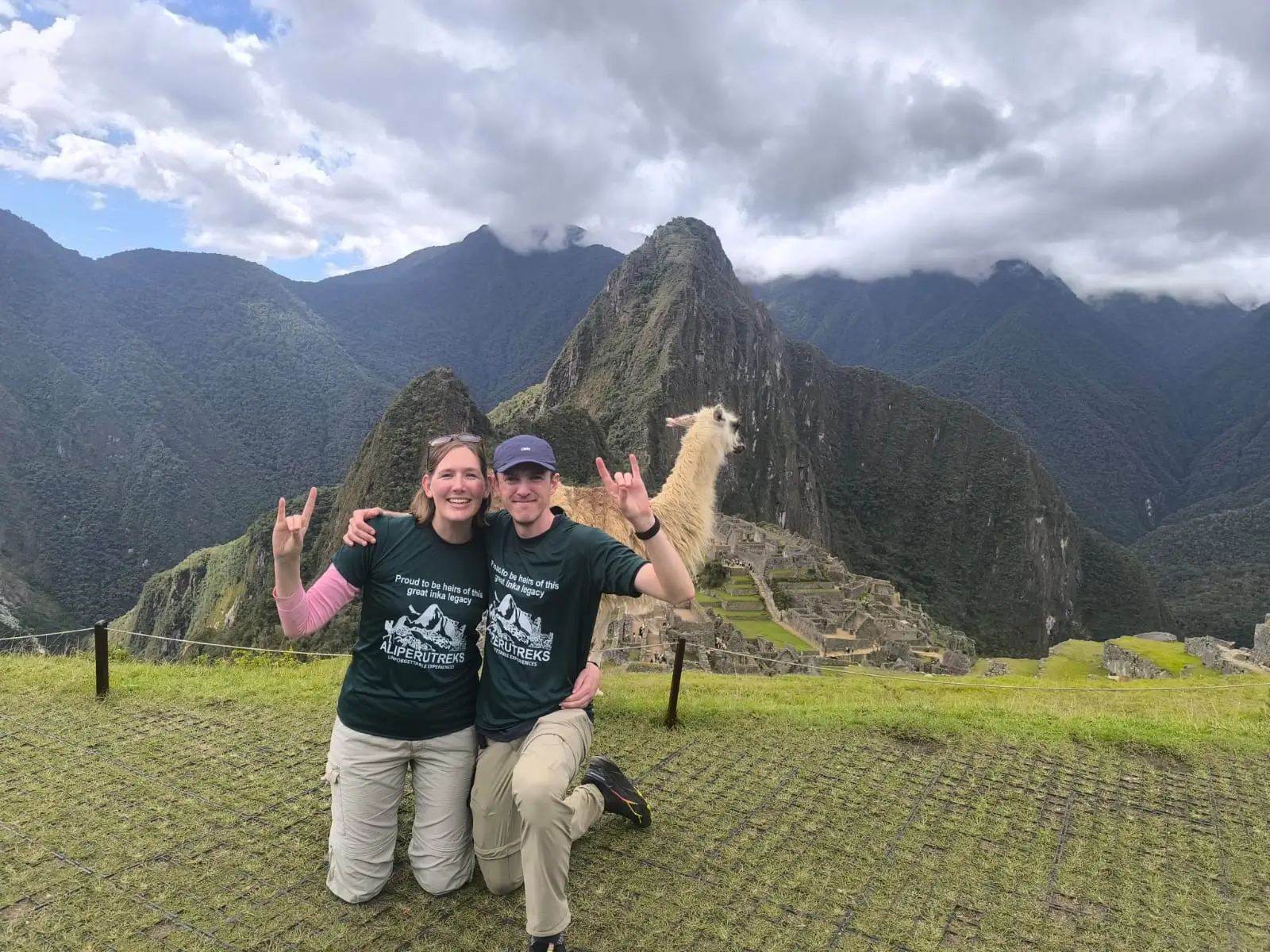 Travelers and a Llama at the Inca Citadel Machu Picchu Tours